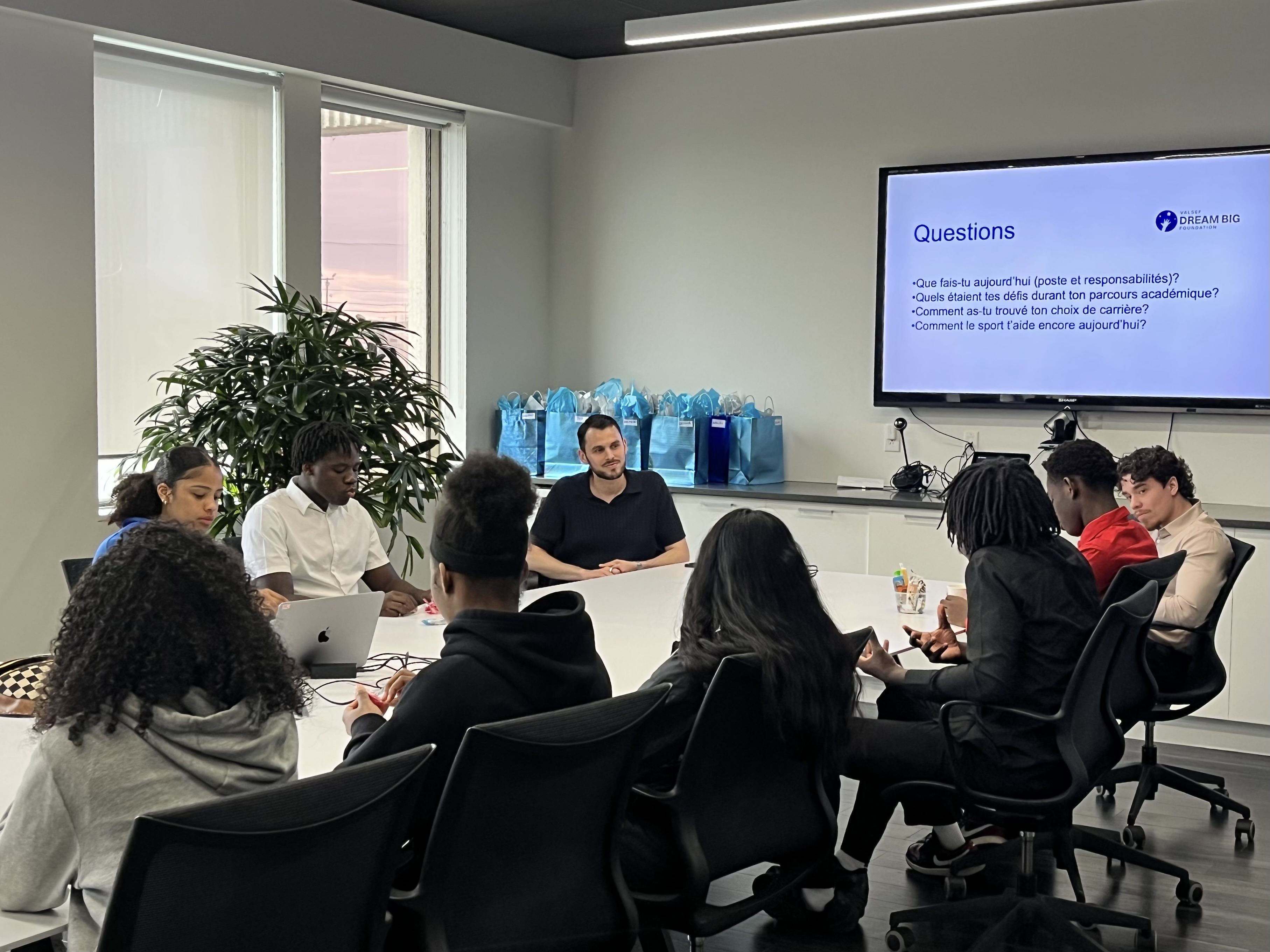 Mars Monnier, Oliver Sanchez and student athletes discussing career paths at Valnet